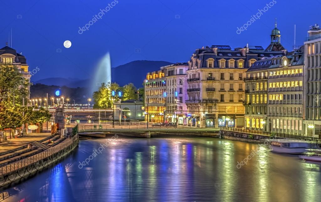 Romantic boutique hotel terrace overlooking Lake Geneva at sunset